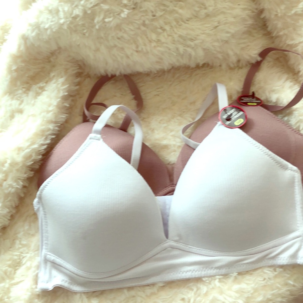 Bras 34B, white and rose Never worn.